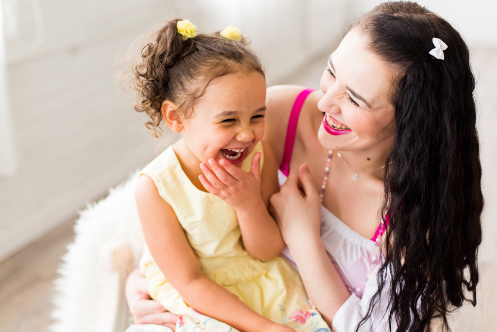 mom and daughter laughing together, seattle family photographer