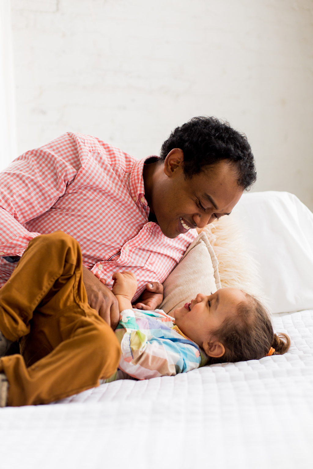 father tickling his son, seattle family photographer