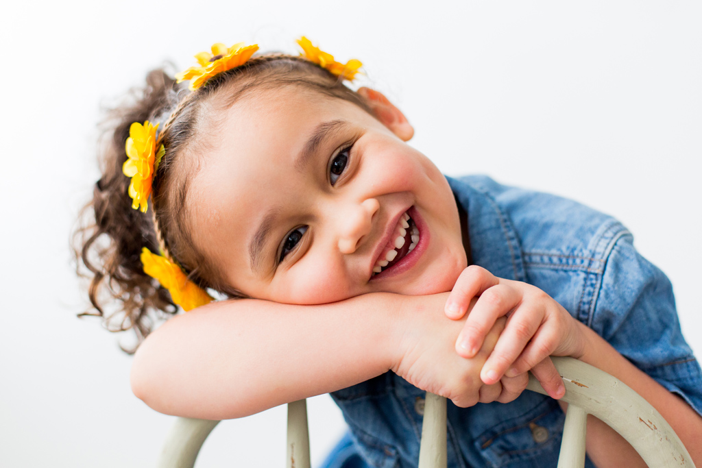 little girl in chair, seattle family lifestle session in studio